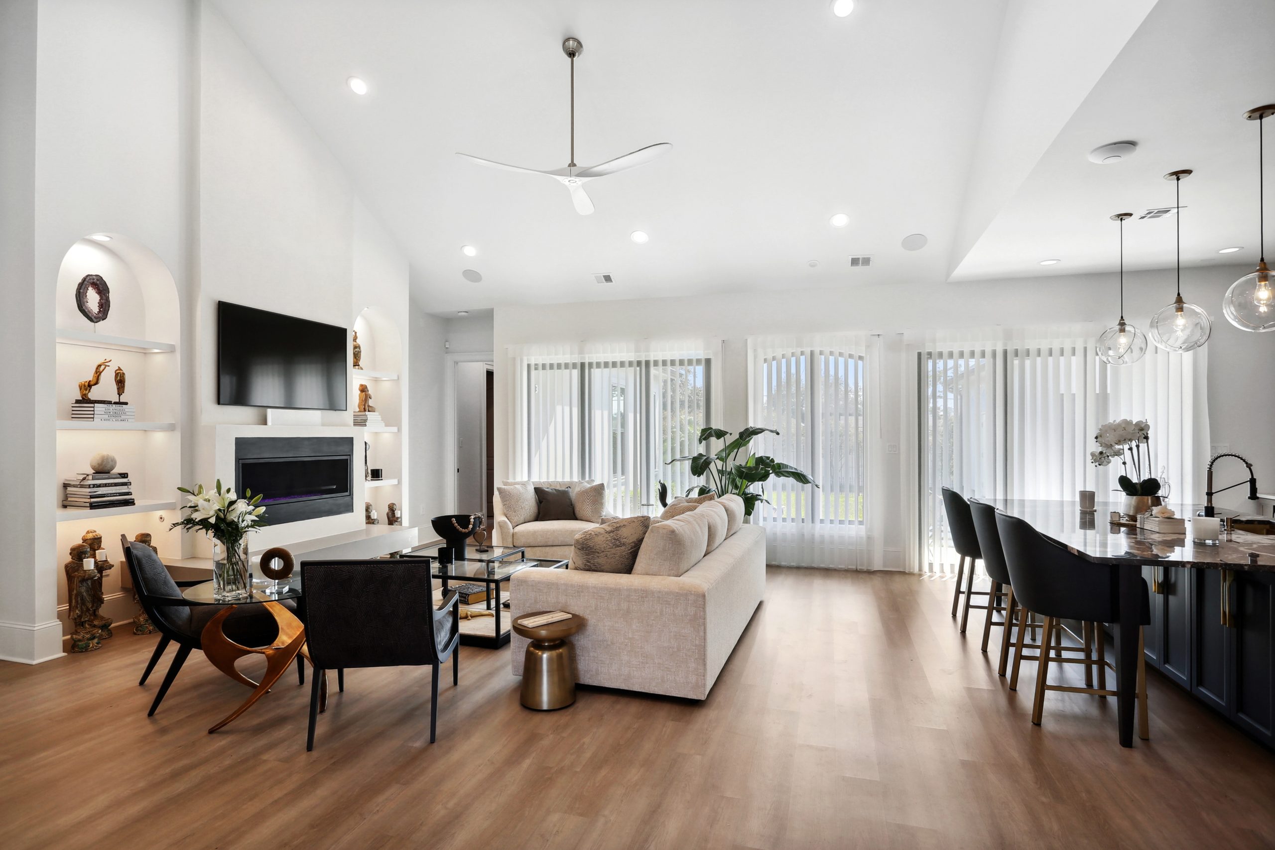 Furnished and decorated open-concept kitchen and living room of Dogwood House new construction luxury home designed and built by DMG