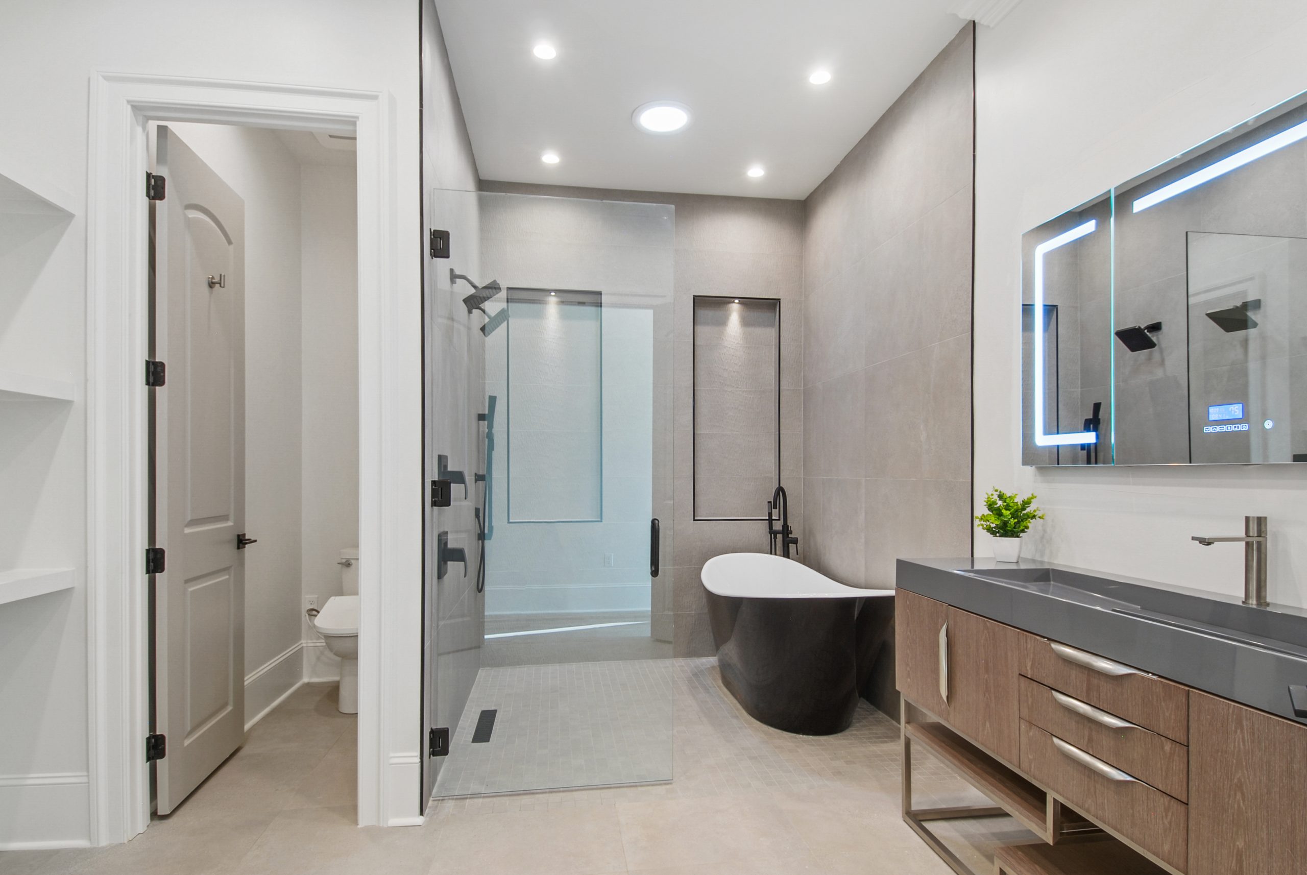 Primary Suite bathroom in Dogwood House luxury new construction custom home designed and built by DMG