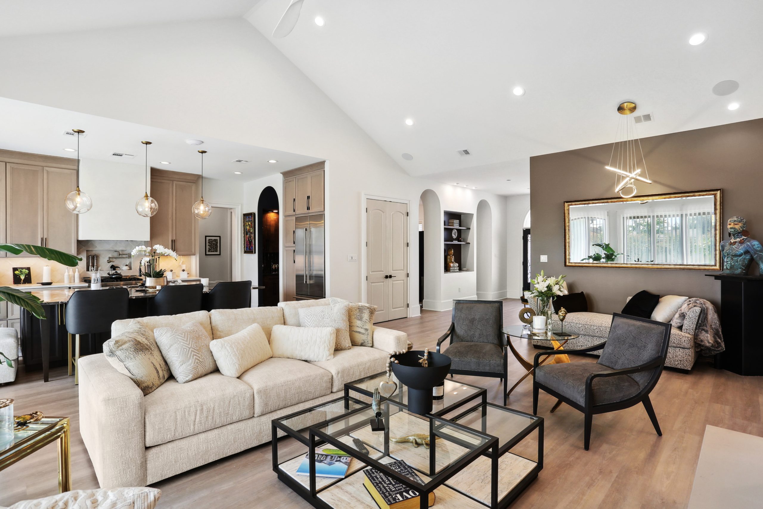 Furnished and decorated open-concept kitchen and living room of Dogwood House new construction luxury home designed and built by DMG