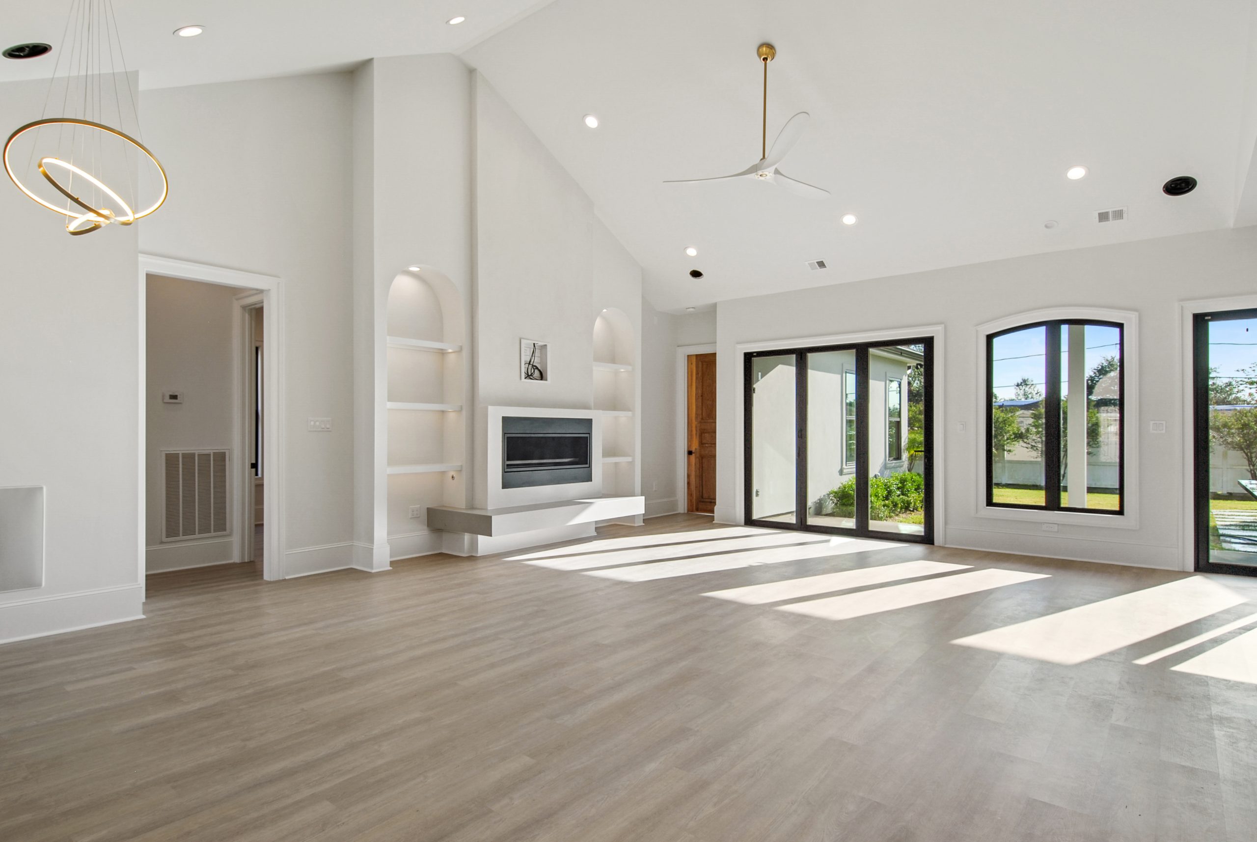 Open-concept living area in Dogwood House luxury new construction custom home designed and built by DMG