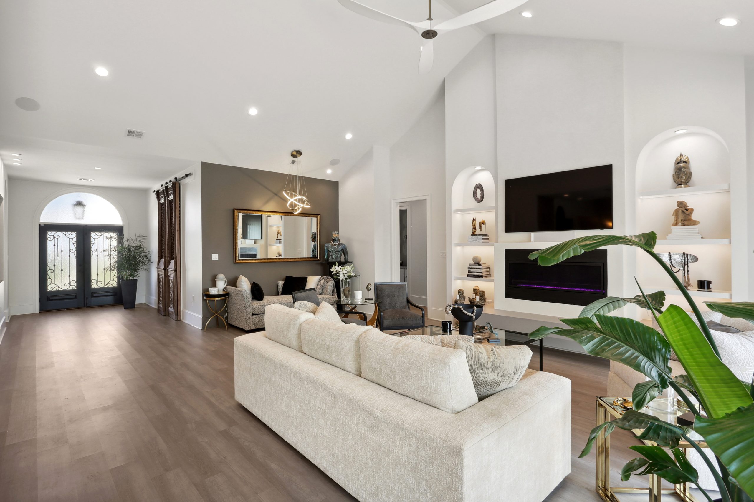 Furnished and decorated open concept living room of Dogwood House new construction luxury home designed and built by DMG