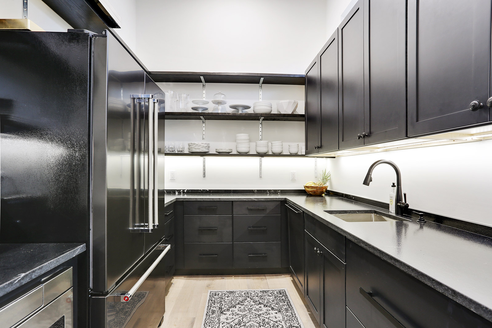 Luxury Modern Custom Kitchen with Black cabinets and open shelving in Elmeer House new construction home designed and built by DMG