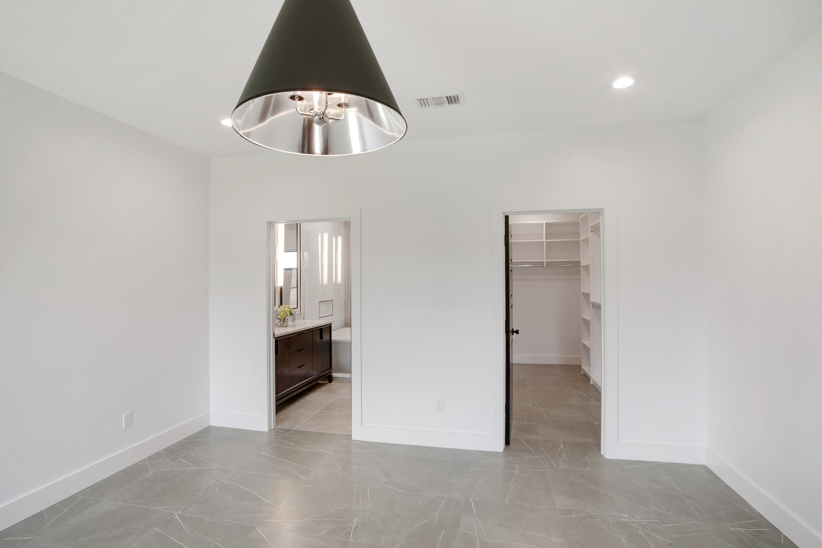 Primary bedroom of Pratt House new construction custom home designed and built by DMG Design+Build